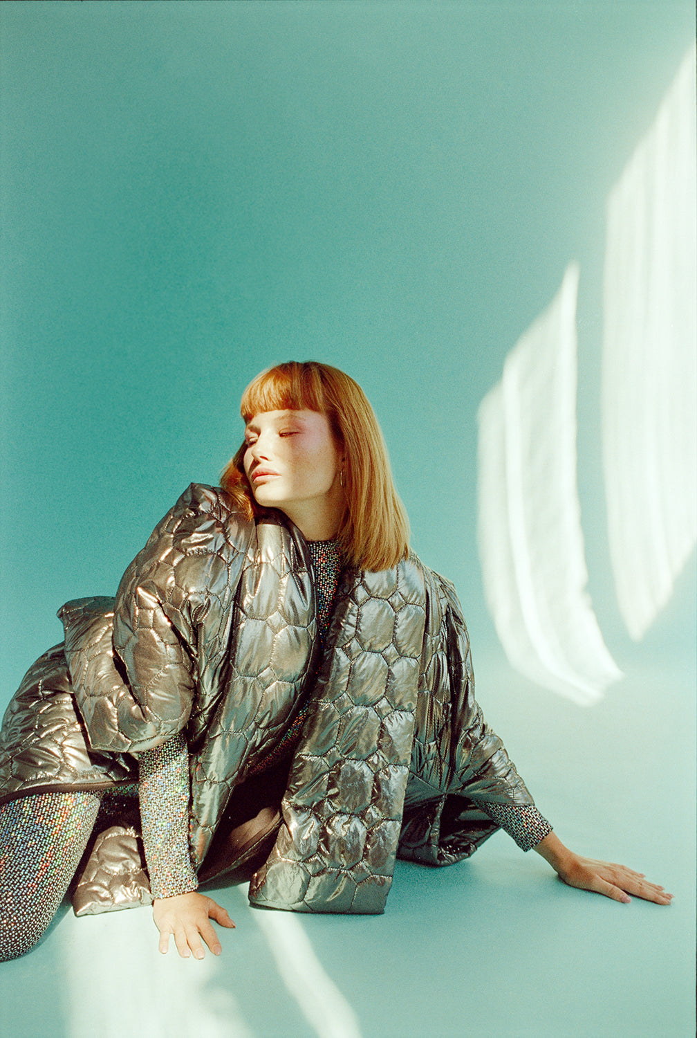 The gunmetal puffer poncho